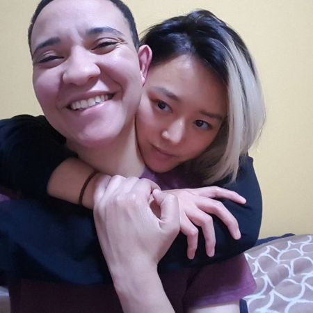 Kiki hugging her girlfriend, Lex at her home